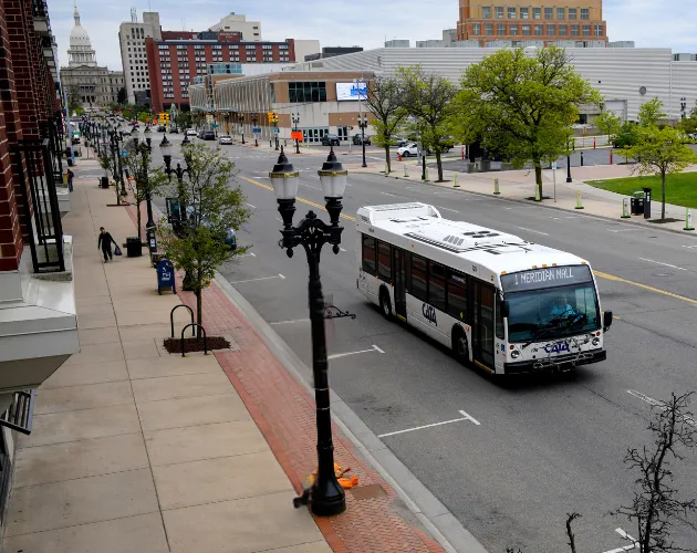 CATA's Route 1 bus driving down Michigan Ave.